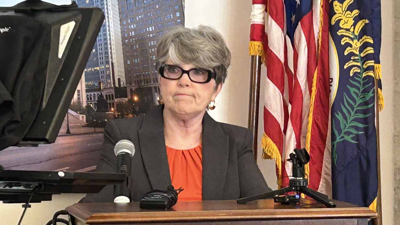 PVA administrator Colleen Younger at podium